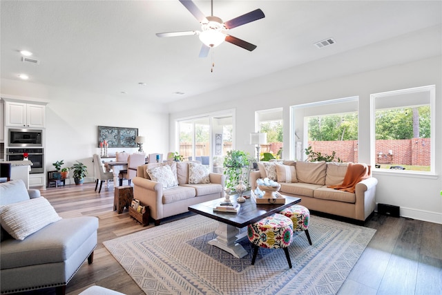 1818 Regent Mill Dr, Missouri City, TX 77459 - living area featuring ceiling fan, light wood finished floors, visible vents, and recessed lighting