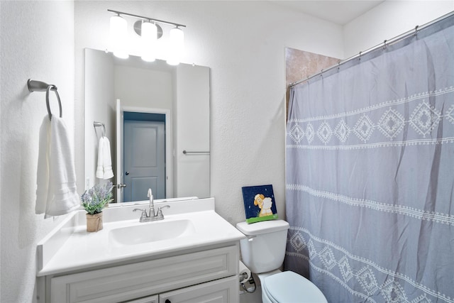 1818 Regent Mill Dr, Missouri City, TX 77459 - full bath with a shower with curtain, a textured wall, vanity, and toilet