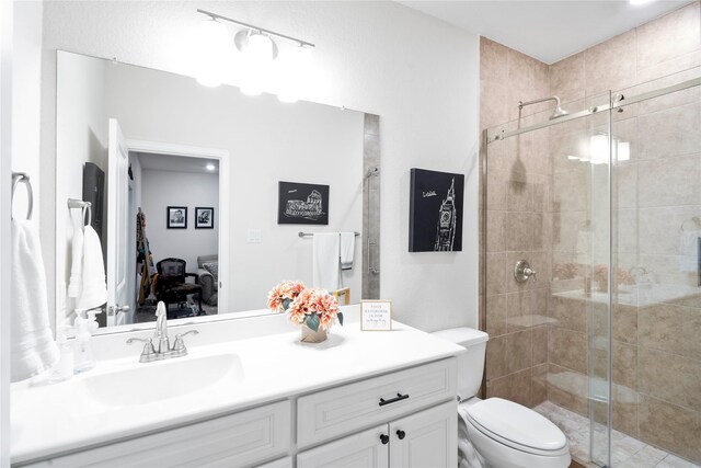 1818 Regent Mill Dr, Missouri City, TX 77459 - bathroom with vanity, a shower stall, and toilet