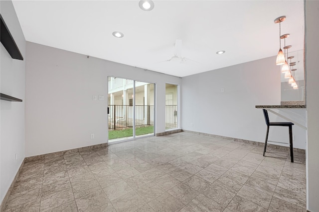 empty room with recessed lighting, marble finish floor, and baseboards
