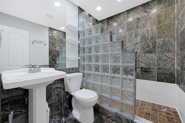 full bath featuring tile walls, a walk in shower, toilet, visible vents, and recessed lighting