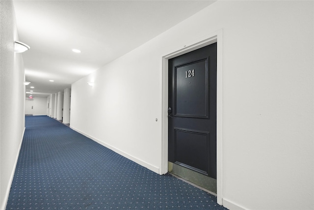corridor with recessed lighting, carpet floors, and baseboards