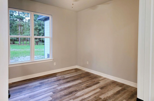 20 Lazy Spgs, Trinity, TX 75862 - spare room with dark wood-type flooring, baseboards, and ceiling fan