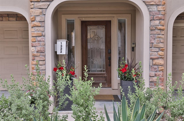 doorway to property featuring stone siding