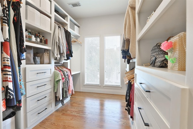 spacious closet featuring visible vents and light wood-style flooring