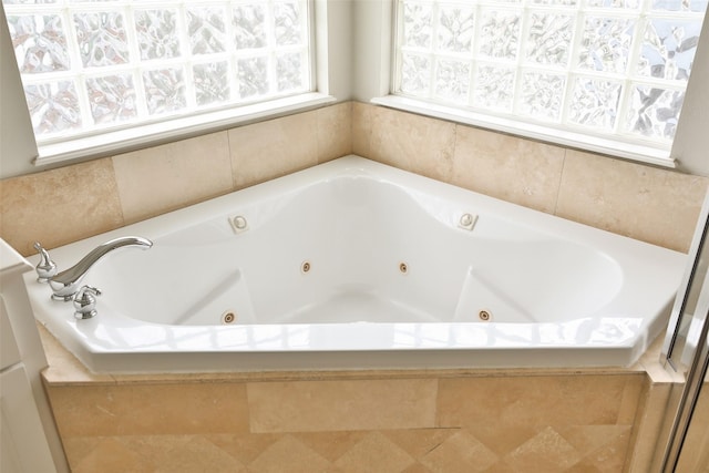 full bath with a jetted tub
