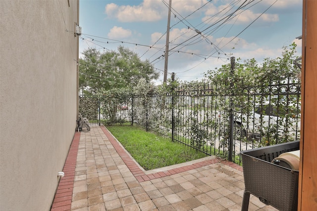 view of patio featuring fence