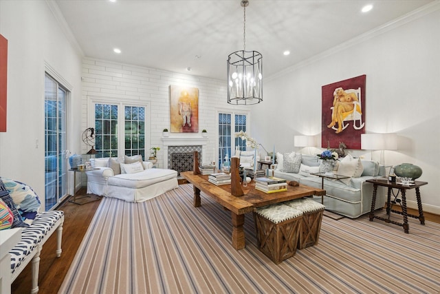 living area with recessed lighting, wood finished floors, and ornamental molding