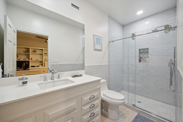 full bathroom featuring toilet, a stall shower, visible vents, recessed lighting, and vanity