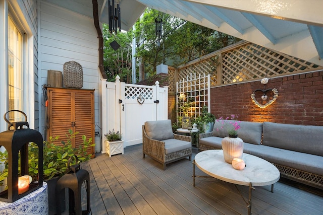 wooden terrace with a gate and fence