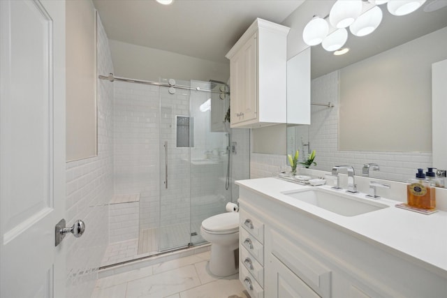 full bathroom featuring toilet, tile walls, marble finish floor, a shower stall, and vanity