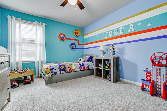 carpeted bedroom featuring a ceiling fan
