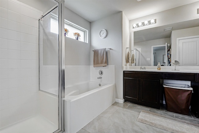 full bath with a garden tub, vanity, and a stall shower
