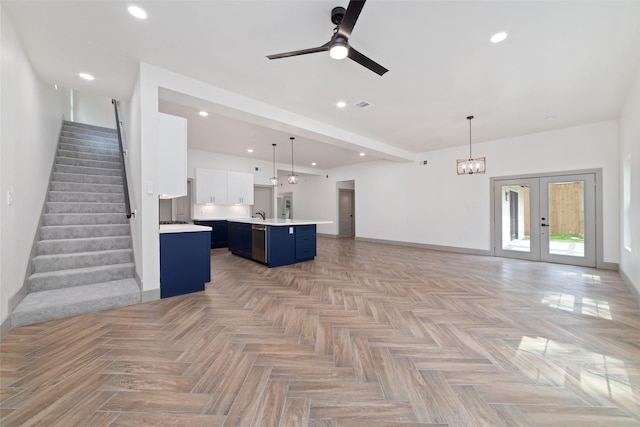 11931 S Red Cedar Cir, The Woodlands, TX 77380 - unfurnished living room with baseboards, ceiling fan, stairway, recessed lighting, and a sink