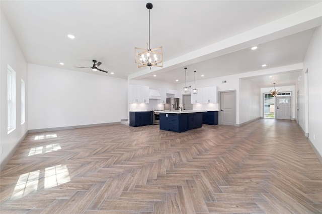 11931 S Red Cedar Cir, The Woodlands, TX 77380 - kitchen featuring a chandelier, open floor plan, appliances with stainless steel finishes, baseboards, and recessed lighting