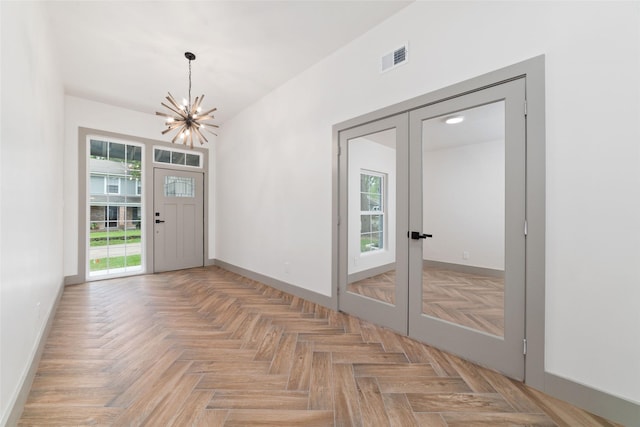 11931 S Red Cedar Cir, The Woodlands, TX 77380 - entryway featuring french doors, a chandelier, baseboards, and plenty of natural light