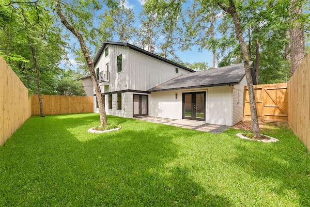 11931 S Red Cedar Cir, The Woodlands, TX 77380 - rear view of house featuring french doors and a patio area