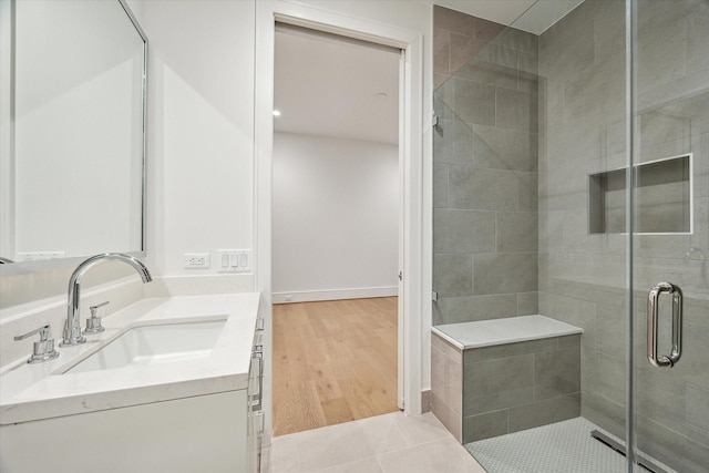 full bathroom with tile patterned floors, a shower stall, and vanity