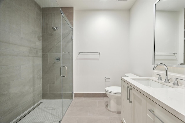 full bathroom featuring vanity, tile patterned floors, toilet, and a shower stall