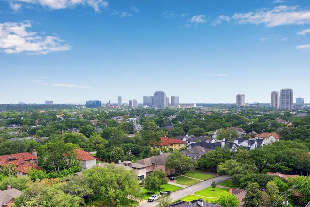 birds eye view of property with a city view