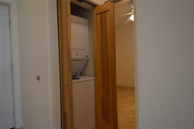 laundry area with stacked washing maching and dryer and laundry area