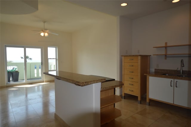 kitchen with a ceiling fan, open shelves, a sink, light tile patterned floors, and recessed lighting