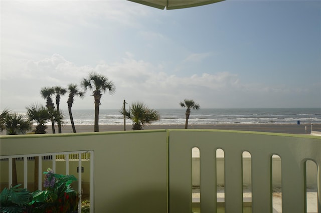 balcony with a beach view and a water view