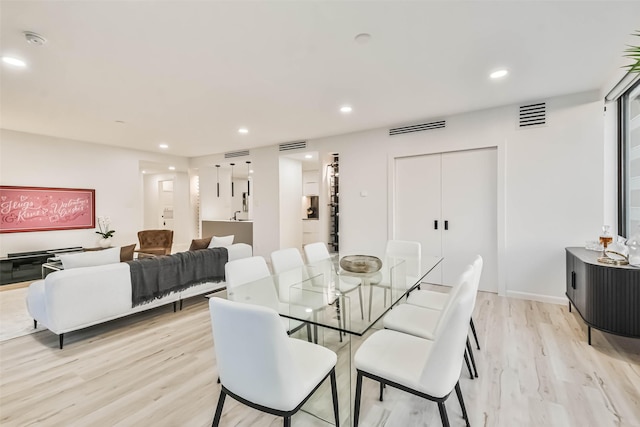 dining room with recessed lighting, light wood-style floors, and visible vents
