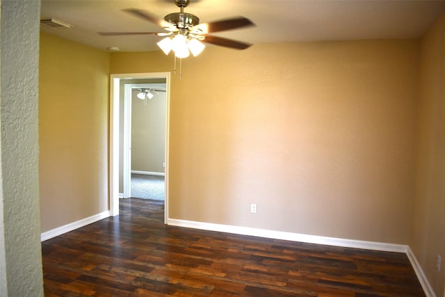 12112 Fm-457, Cedar Lane, TX 77415 - spare room with a ceiling fan, dark wood finished floors, and baseboards