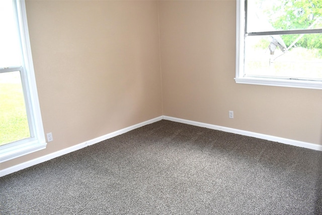 12112 Fm-457, Cedar Lane, TX 77415 - spare room with dark carpet, baseboards, and healthy amount of natural light