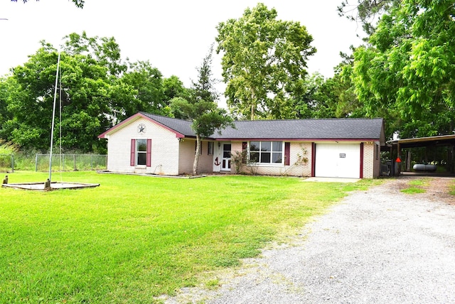 12112 Fm-457, Cedar Lane, TX 77415 - ranch-style house with gravel driveway, brick siding, a carport, an attached garage, and view of wooded area