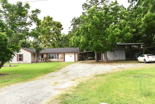 12112 Fm-457, Cedar Lane, TX 77415 - ranch-style house with a carport, driveway, and a front lawn