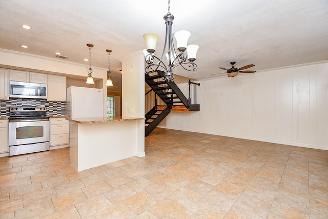 kitchen with stainless steel appliances, visible vents, ceiling fan with notable chandelier, decorative backsplash, and hanging light fixtures