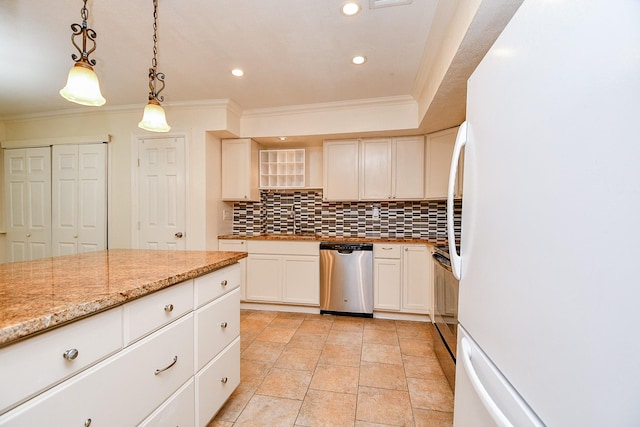 kitchen featuring stainless steel dishwasher, tasteful backsplash, crown molding, freestanding refrigerator, and recessed lighting