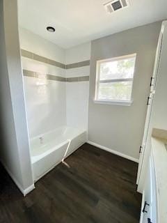 full bathroom with bathtub / shower combination, baseboards, visible vents, wood finished floors, and vanity