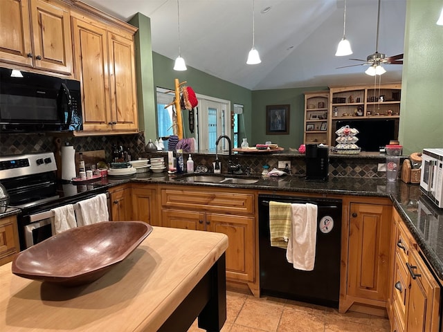 kitchen with lofted ceiling, a sink, black appliances, and tasteful backsplash