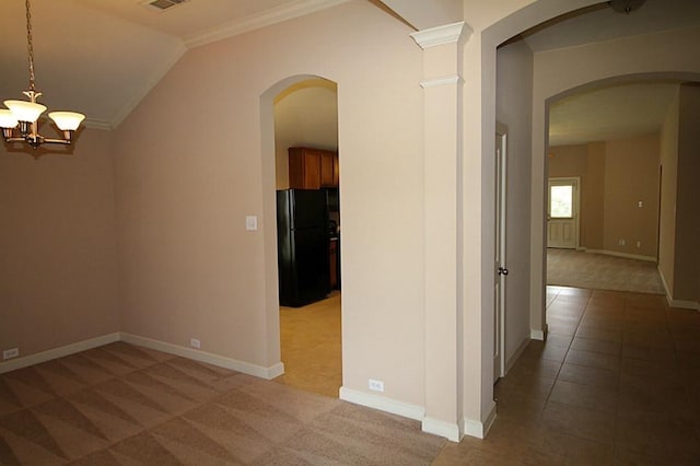 hall featuring arched walkways, a notable chandelier, light carpet, and ornamental molding