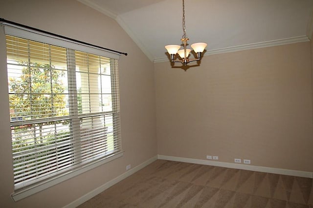 carpeted spare room featuring crown molding, baseboards, a chandelier, and lofted ceiling