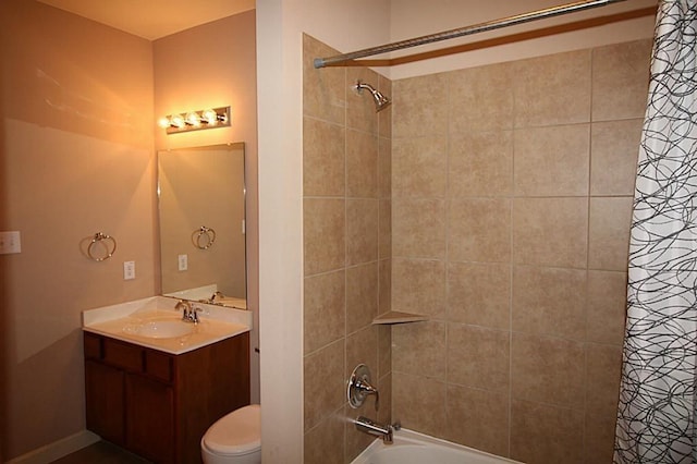 bathroom featuring vanity, shower / bath combination with curtain, and toilet