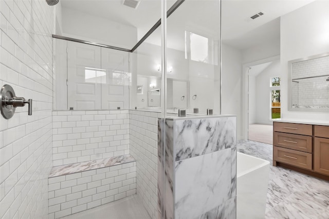 bathroom featuring marble finish floor, visible vents, vanity, and a stall shower