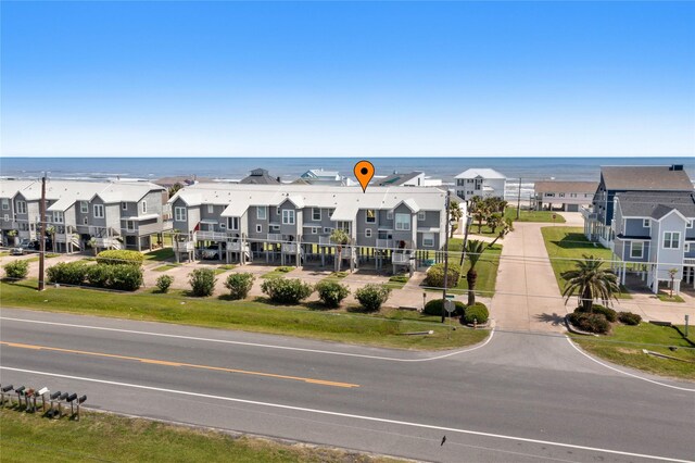 birds eye view of property with a water view and a residential view