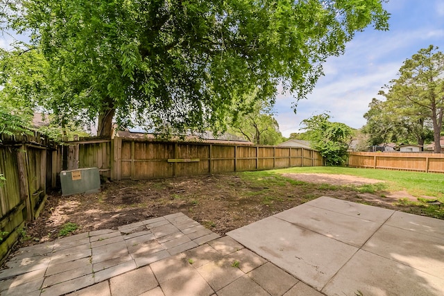 view of yard featuring a patio area and a fenced backyard