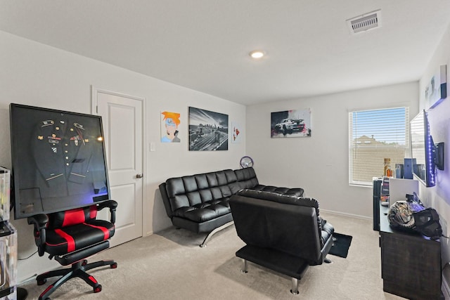 carpeted living area featuring visible vents and recessed lighting