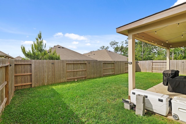 view of yard with a fenced backyard