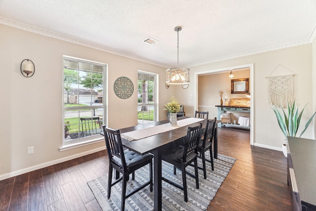 dining room with ornamental molding, visible vents, dark wood-style flooring, and baseboards