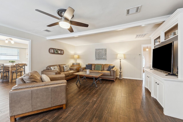 living area featuring crown molding, a ceiling fan, and visible vents