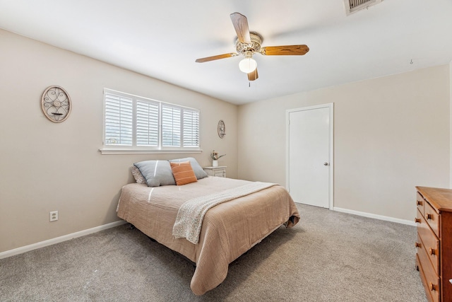 bedroom featuring a ceiling fan, visible vents, carpet, and baseboards