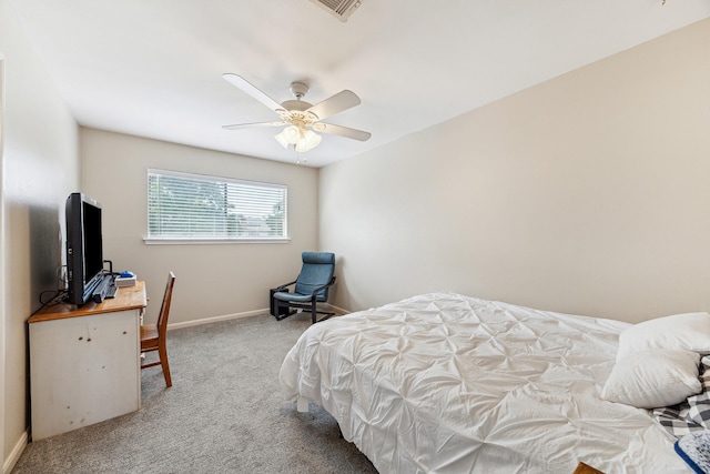 carpeted bedroom featuring ceiling fan, visible vents, and baseboards