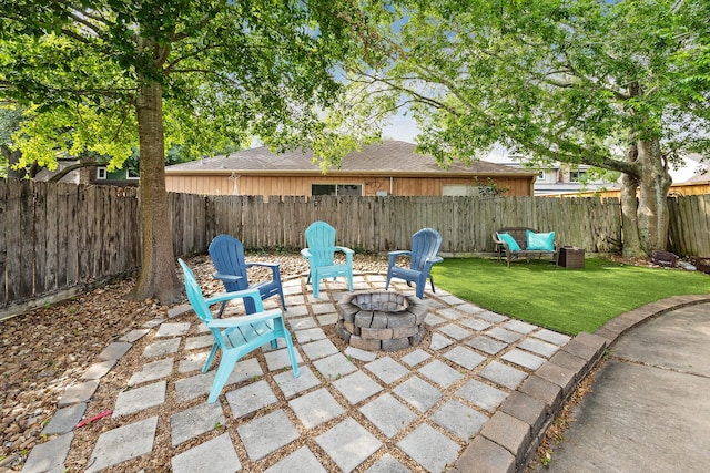 view of patio with a fire pit and a fenced backyard