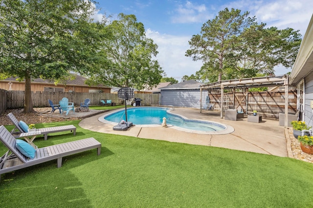view of pool featuring a lawn, a patio, a fire pit, and a fenced backyard